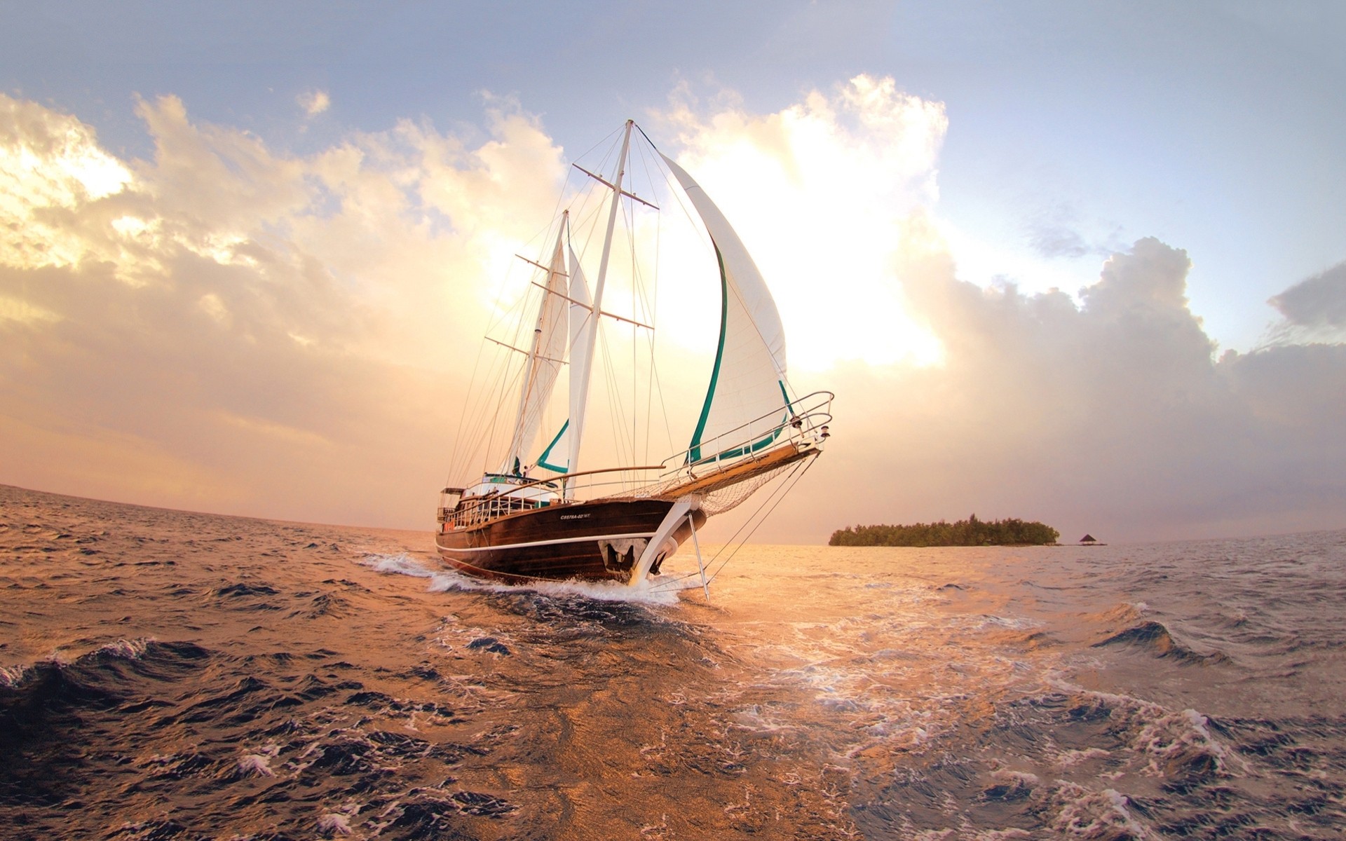 clouds ocean island sky sea sailboats yacht