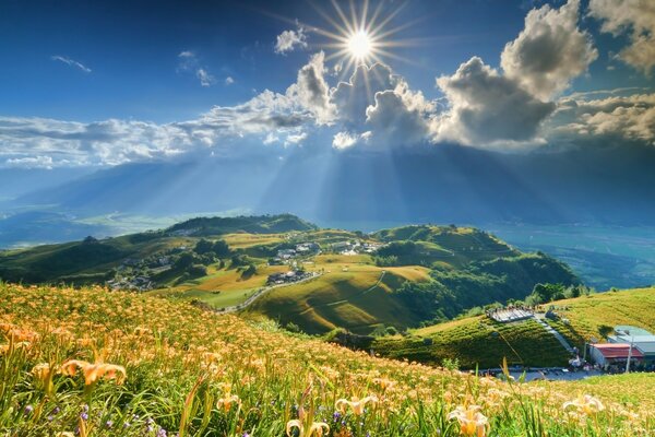 Bright sun over mountainous terrain