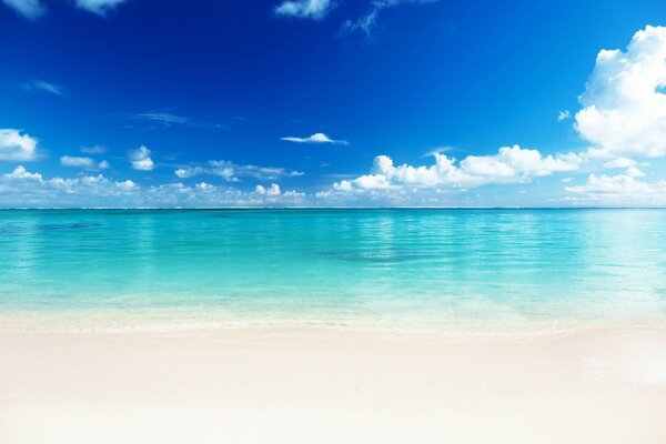 White sandy beach and blue sky