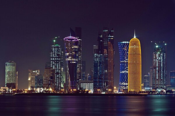 Night skyscrapers and the sea