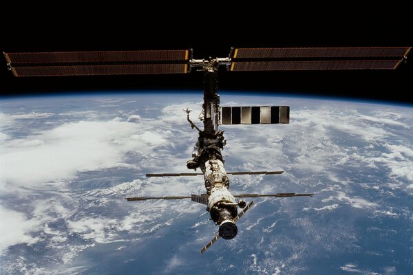 Photo of the space station on the background of the earth