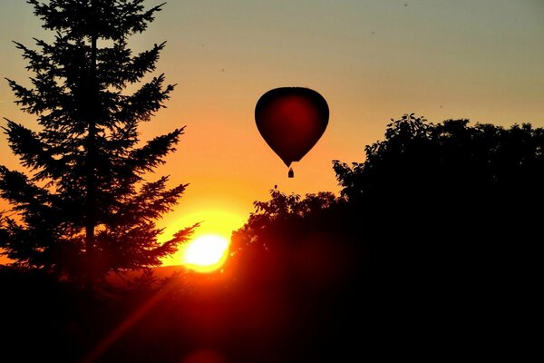 Flying into the sky on a balloon, in a beautiful dawn!