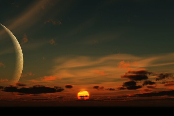 View of the setting sun and the rising moon in the clouds