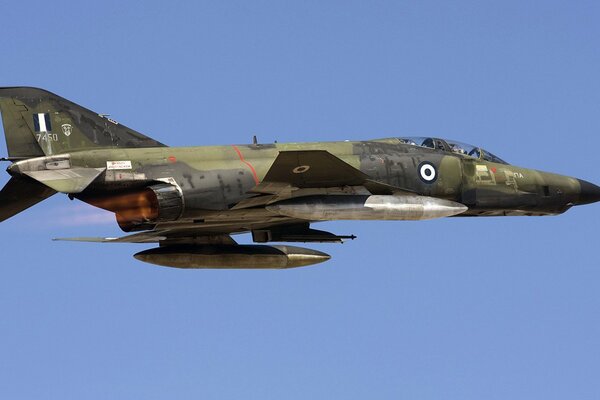 Military aircraft. Blue sky