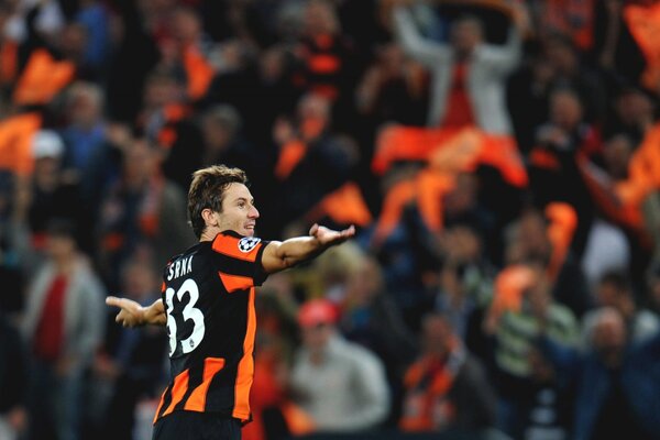 A player in the stadium waves his hands