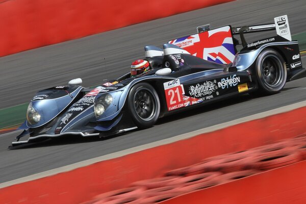 Sports car with the flag of Great Britain with a driver