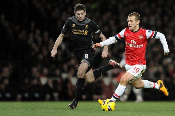 Midfielder jack Wilshere on the pitch Steven Gerrard