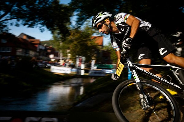 An athlete rides a mountain bike