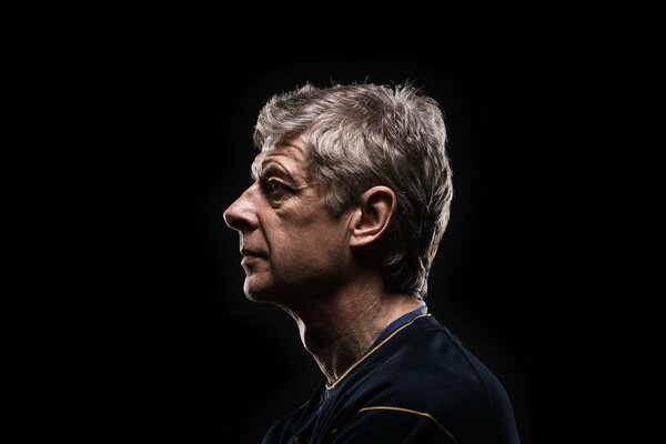 Arsene Wenger portrait on a dark background