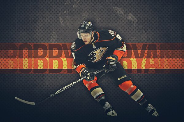 Bobby Ryan with a stick on a dark background