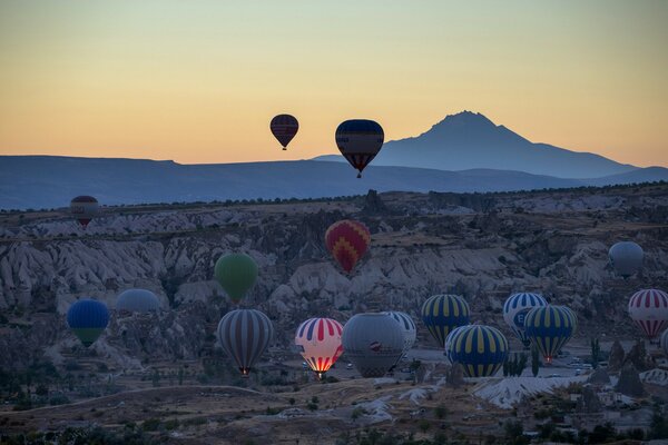 Lots of balloons in the mountains