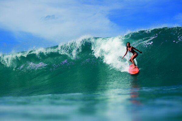 The girl on the Red Board in the ocean