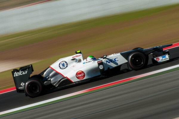 A racing car is driving on the highway