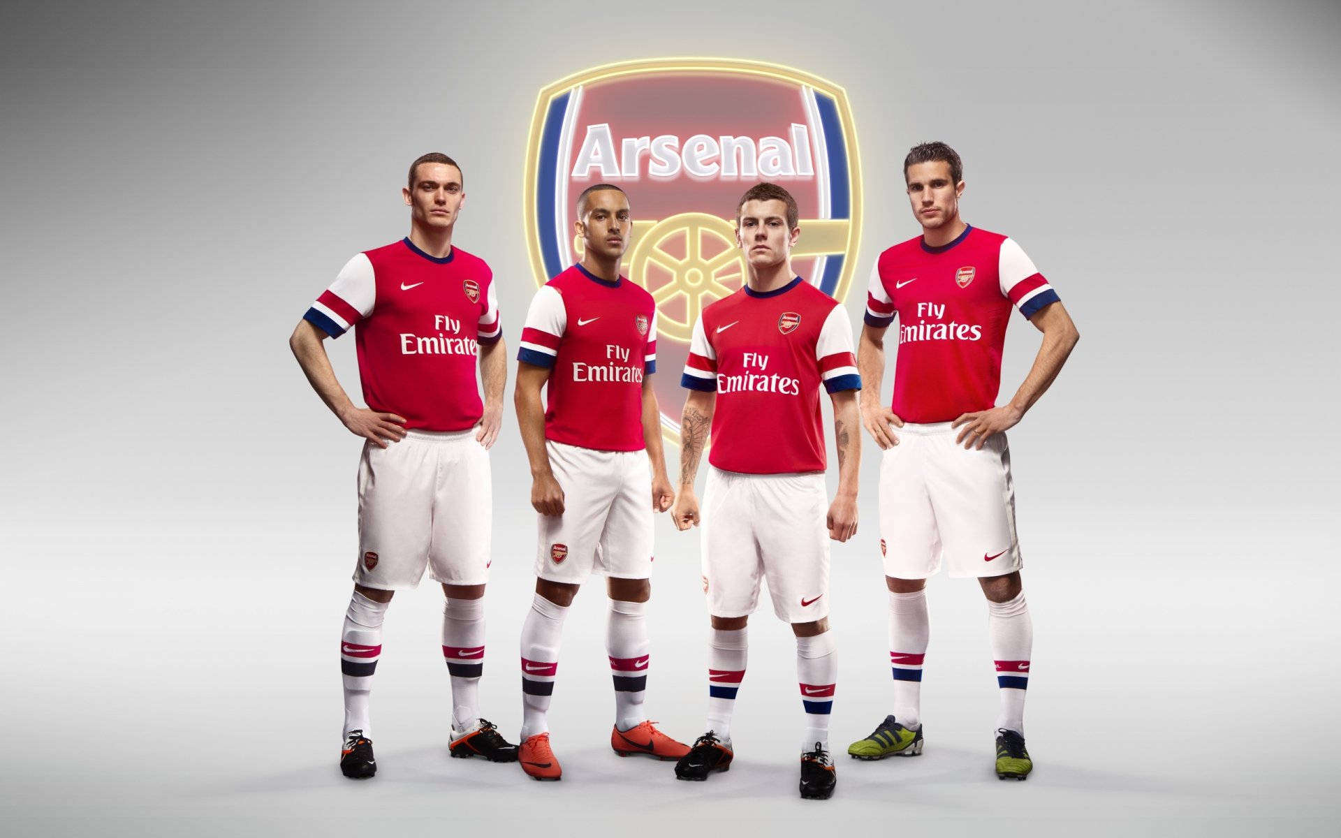 arsenal football club gunners emblem logo players robin van persie thomas vermaelen theo walcott jack wilshere background