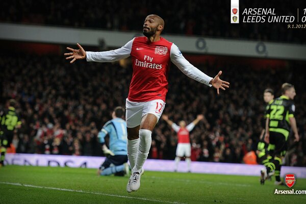 French footballer Thierry Henry runs across the field