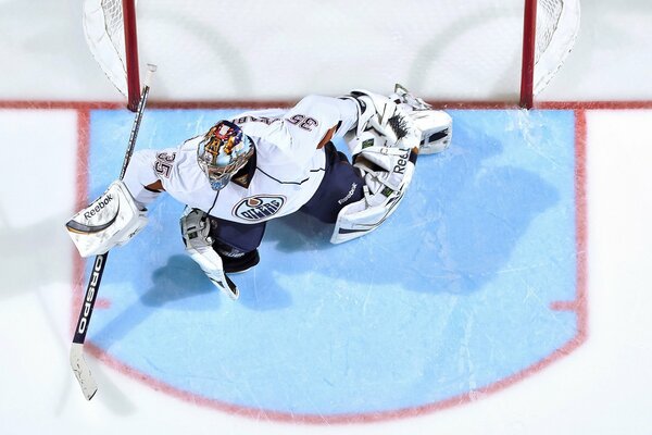 Hockey goalkeeper in uniform at the gate