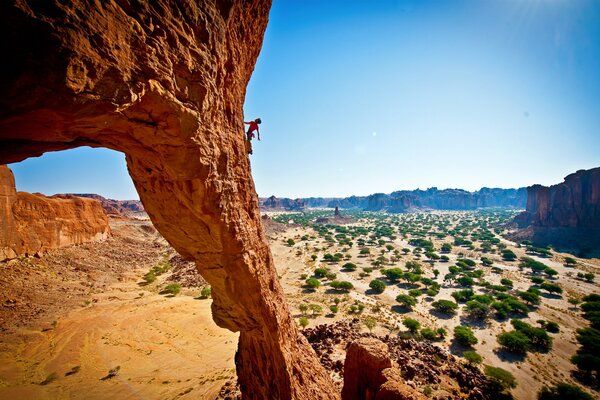 Man climber descent from the canyon