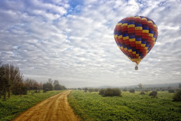 Balloon over a green field