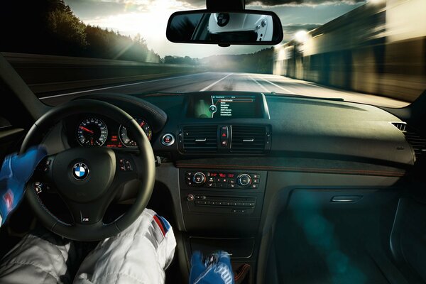 A racer on the track is driving a BMW