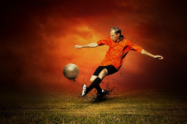 Futbolista con camiseta roja golpea el balón de oro