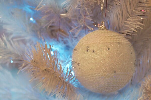 Christmas tree with a white ball