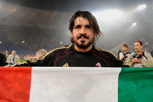 Crazy Gattuso holds the flag