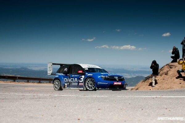 Racing car near the mountain range