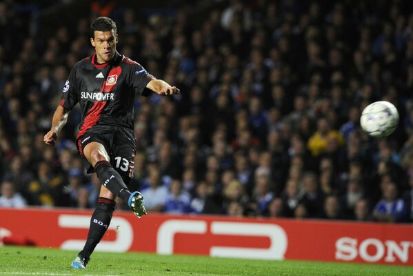 Michael Ballack hits the ball