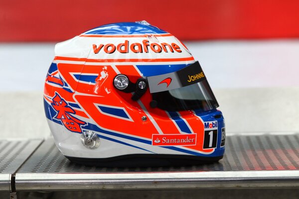 Formula 1 pilot s helmet in red and blue tones