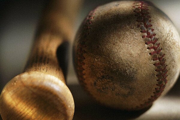 Recumbent bat with a ball in sports