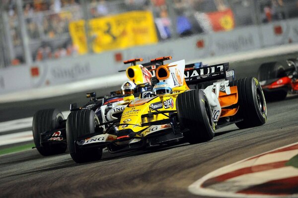 Yellow car on the Formula 1 track overtakes rivals