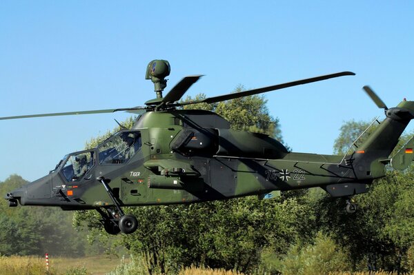 Eurocopter on a clear sky background