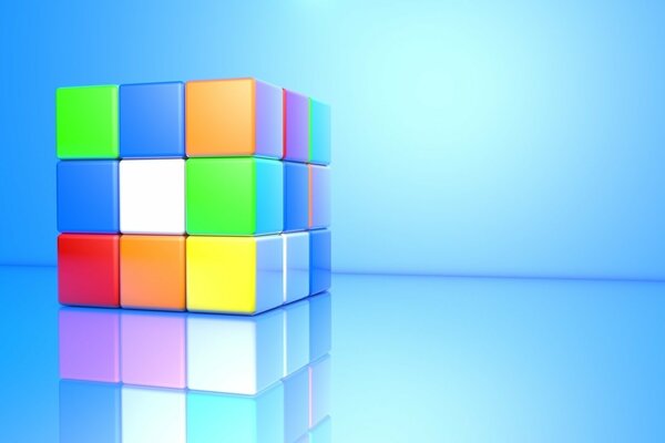 Rubik s cube with reflection on a blue background