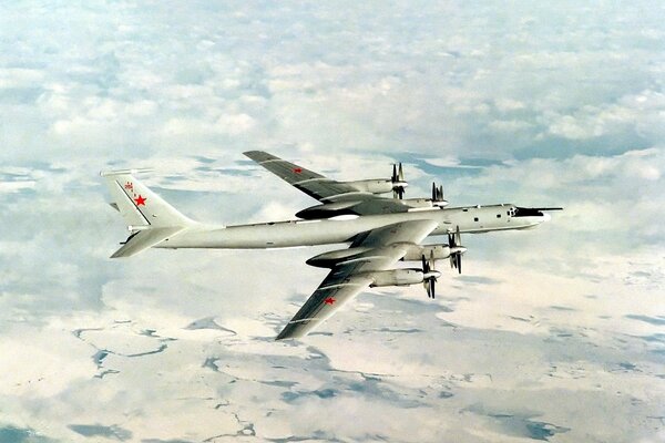 Soviet plane flies over white clouds