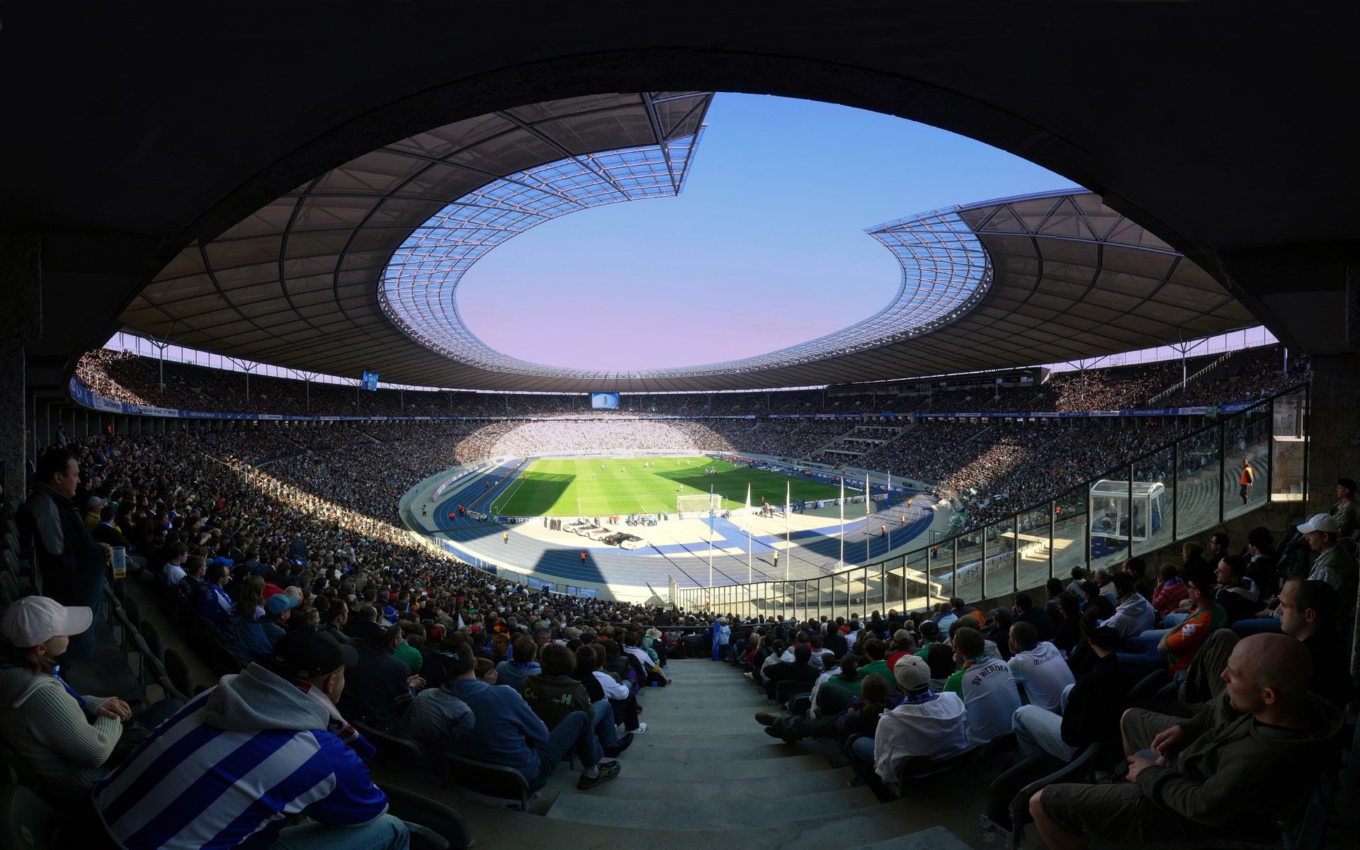 sport stades personnes fans fans football vue fond créatif herbe sièges public tribune tribunes joueurs de football joueurs athlètes fans