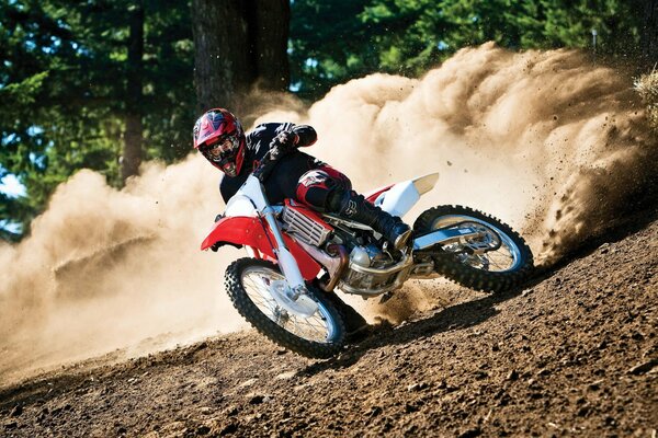 Motorcycle racer raised dust on the track