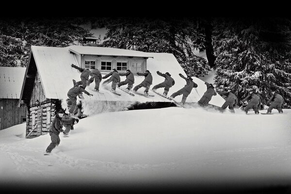 Ein Bild aus einem Schwarz-Weiß-Film über Skifahrer im verschneiten Winter