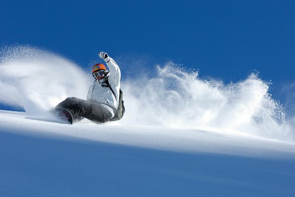 The descent of a snowboarder from the mountain