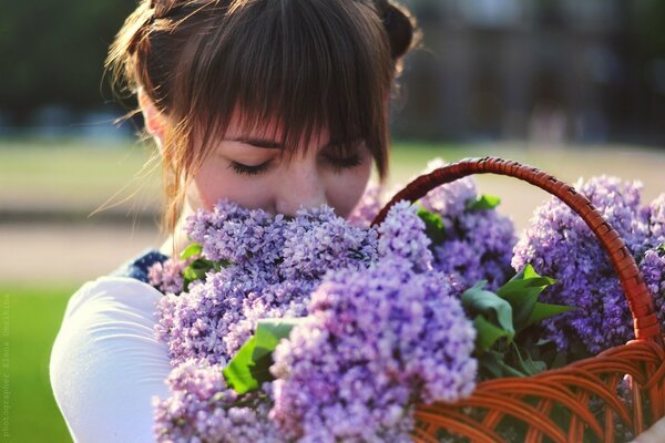 Cute girl with a picture of lilac