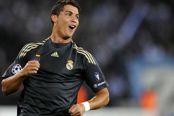 Happy Cristiano Ronaldo in black football uniform