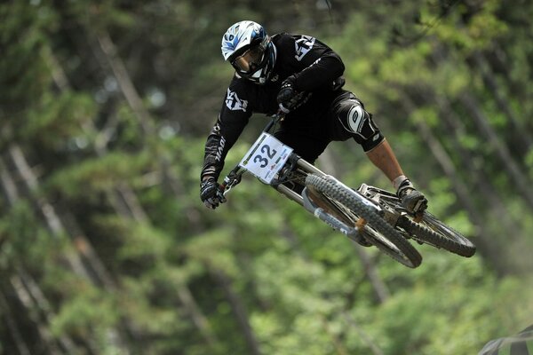 A cyclist s jump on a bike