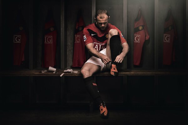 Rooney. A football player in the locker room. Manchester