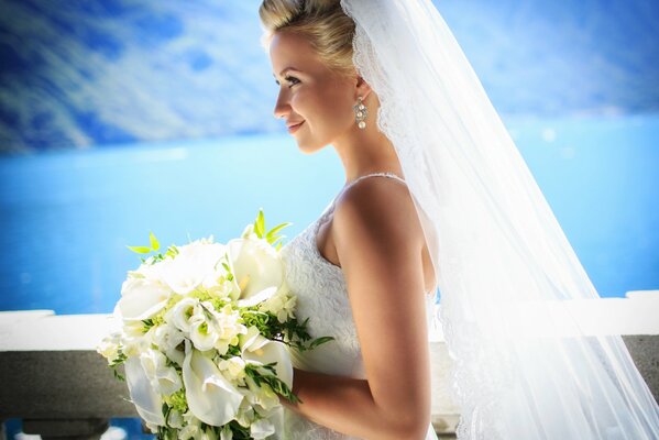 The bride in a white dress with a bouquet