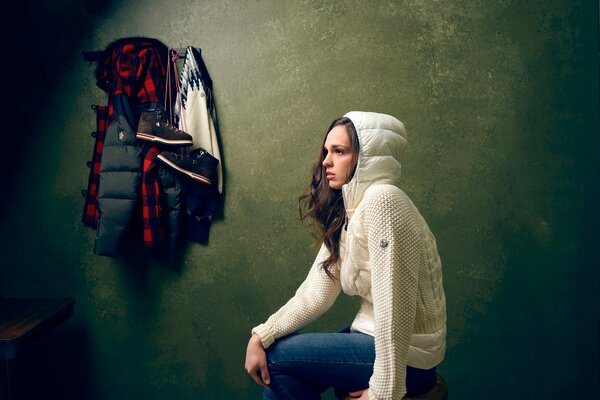 Thoughtful girl in a white jacket