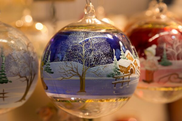 Christmas transparent balloons with a decor in the form of a winter landscape