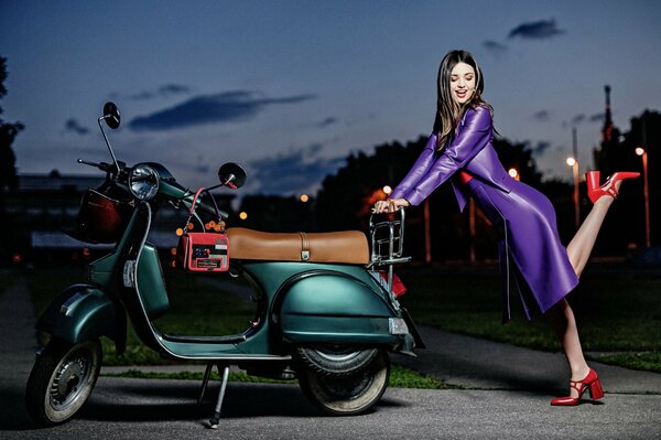 Miranda Kerr in a purple dress and red shoes