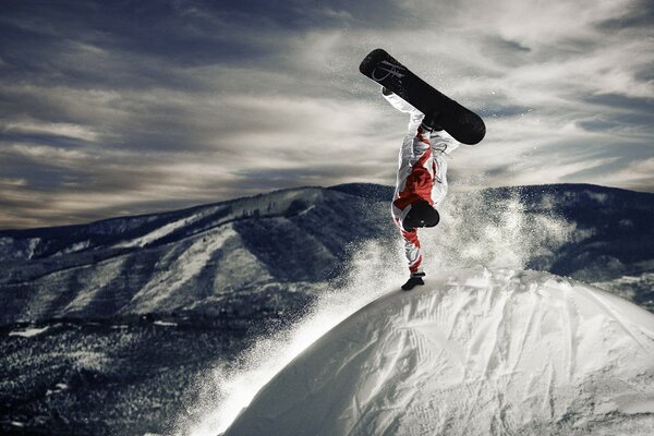 A snowboarder climbed a snow-covered mountain