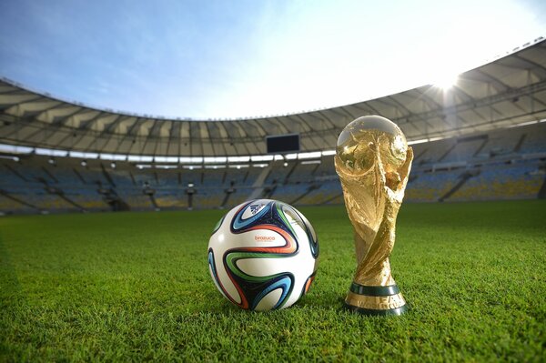 Balón y Copa de Campeones en el estadio