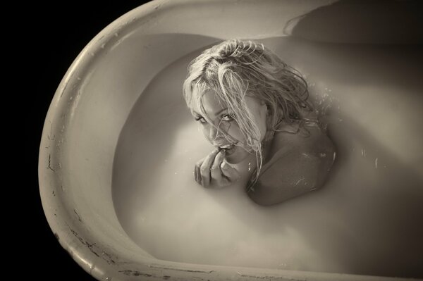 Cute blonde with wet hair in the bathroom