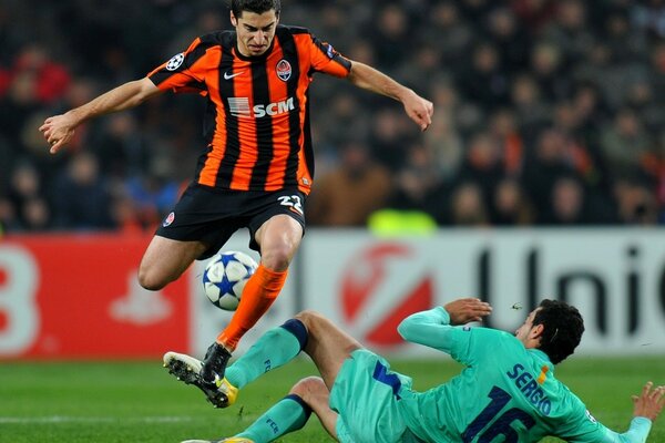 A shot from a football match with two football players